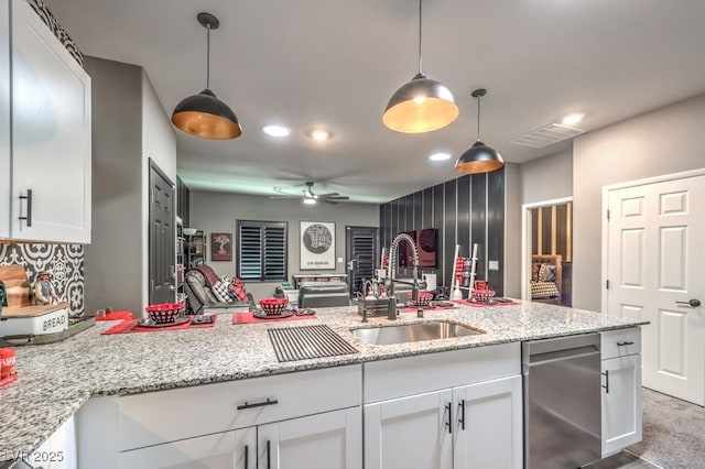 7472 Garnet Moon St, North Las Vegas, NV 89084 - kitchen featuring dishwasher, white cabinetry, open floor plan, recessed lighting, and decorative light fixtures
