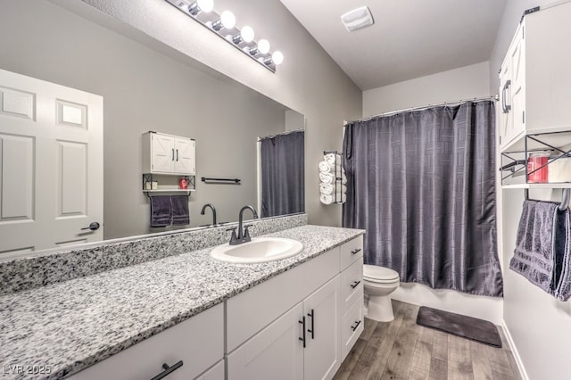 7472 Garnet Moon St, North Las Vegas, NV 89084 - full bathroom featuring wood finished floors, vanity, and shower / bath combo with shower curtain