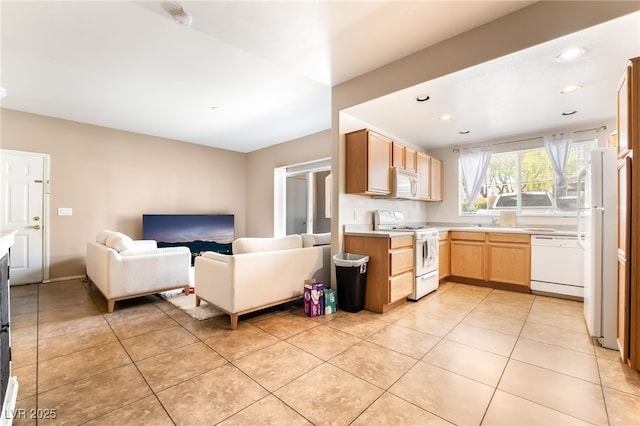 9330 W Maule Ave Unit 138, Las Vegas, NV 89148 - kitchen with white appliances, open floor plan, light countertops, light tile patterned floors, and recessed lighting