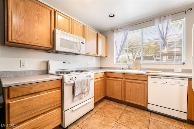 9330 W Maule Ave Unit 138, Las Vegas, NV 89148 - kitchen featuring white appliances, light countertops, and light tile patterned floors