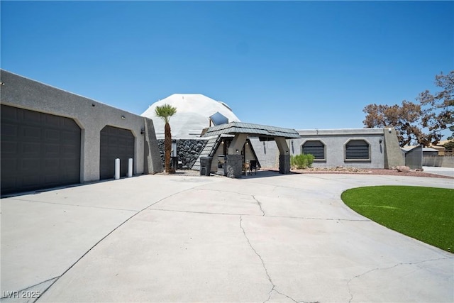 7215 Ullom Dr, Las Vegas, NV 89118 - view of front of property featuring stucco siding and a garage