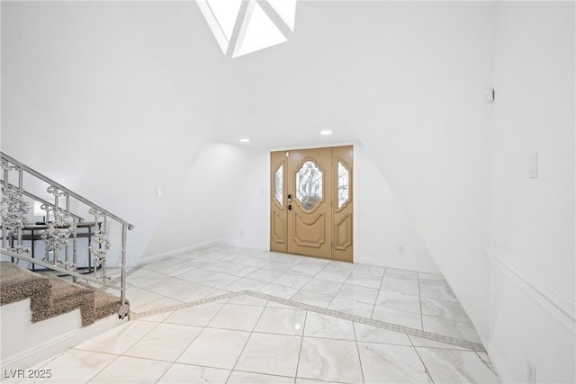 7215 Ullom Dr, Las Vegas, NV 89118 - foyer entrance with a skylight, stairway, recessed lighting, and vaulted ceiling