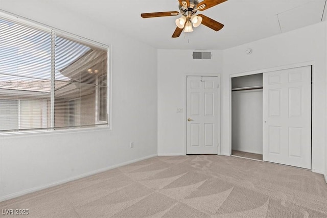 664 Peachy Canyon Cir Unit 103, Las Vegas, NV 89144 - unfurnished bedroom featuring light carpet, a closet, attic access, and a ceiling fan