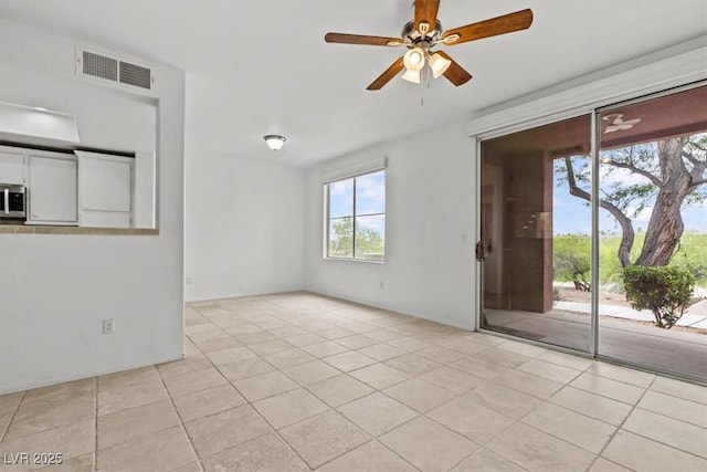 664 Peachy Canyon Cir Unit 103, Las Vegas, NV 89144 - empty room with light tile patterned flooring and ceiling fan
