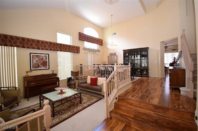 1700 Double Arrow Pl, Las Vegas, NV 89128 - staircase with high vaulted ceiling, wood finished floors, and a ceiling fan