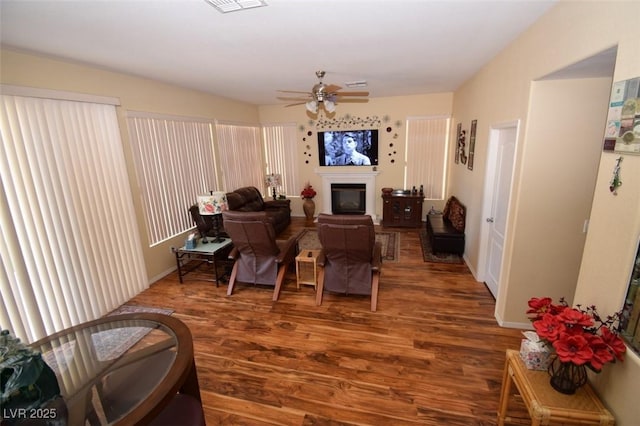 1700 Double Arrow Pl, Las Vegas, NV 89128 - living room with wood finished floors, a glass covered fireplace, and a ceiling fan