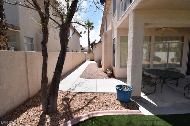 1700 Double Arrow Pl, Las Vegas, NV 89128 - fenced backyard with a ceiling fan and a patio
