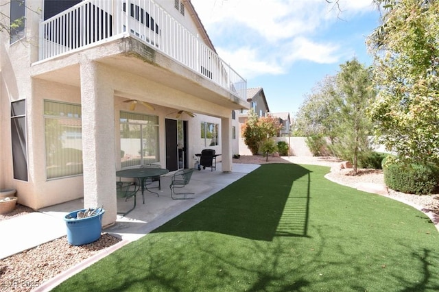 1700 Double Arrow Pl, Las Vegas, NV 89128 - view of yard featuring a balcony, a ceiling fan, and a patio