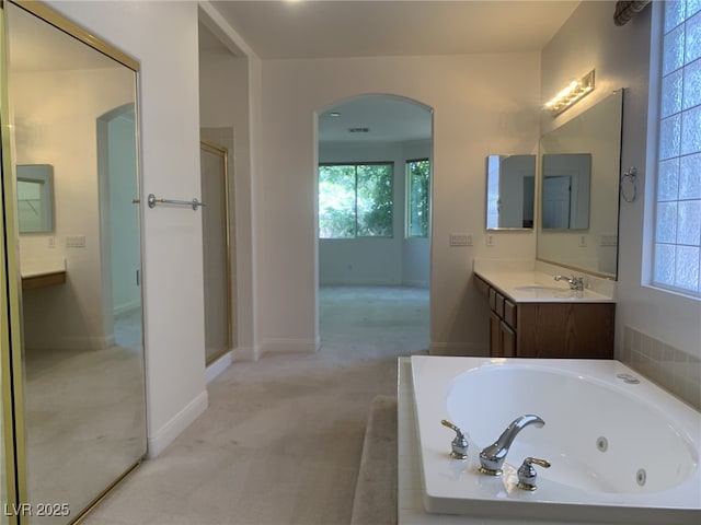 3328 White Bark Pine St, Las Vegas, NV 89129 - bathroom featuring a whirlpool tub, vanity, and a stall shower