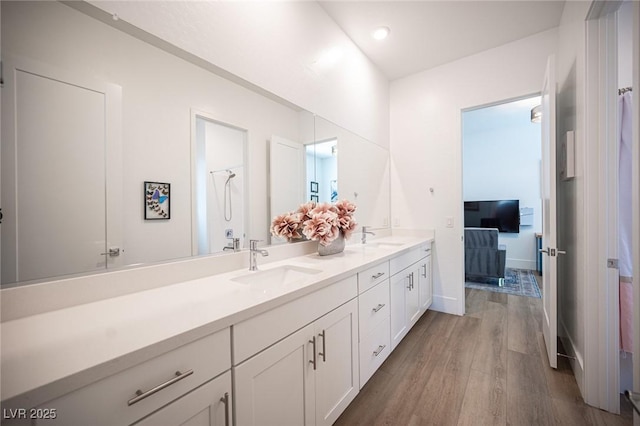 11248 Rebel Dome Ct, Las Vegas, NV 89141 - bathroom with double vanity and wood finished floors