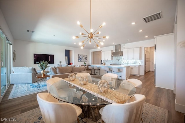 11248 Rebel Dome Ct, Las Vegas, NV 89141 - dining space featuring wood finished floors, a chandelier, and recessed lighting
