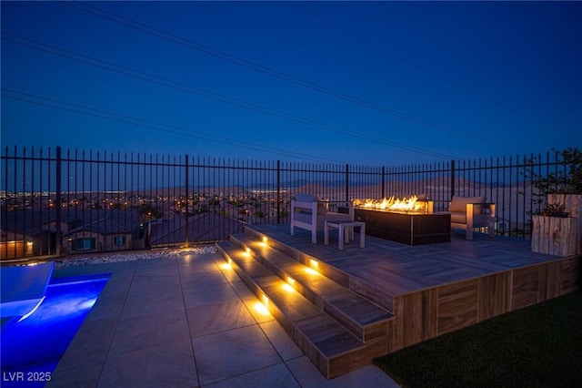 11248 Rebel Dome Ct, Las Vegas, NV 89141 - view of patio / terrace with a fire pit
