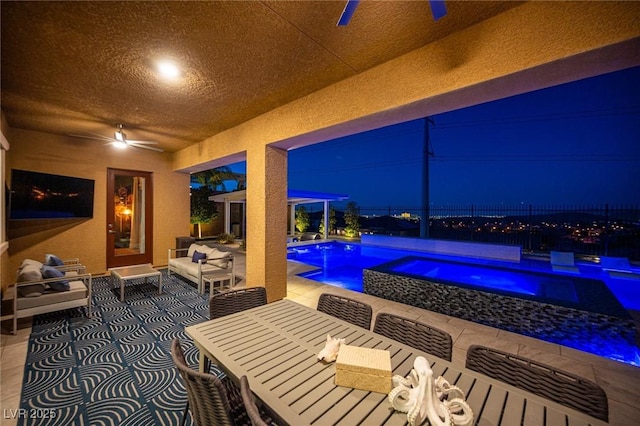 11248 Rebel Dome Ct, Las Vegas, NV 89141 - patio at twilight featuring an in-ground hot tub, a ceiling fan, outdoor dining space, and a patio area