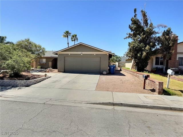 3585 Winner Dr, Las Vegas, NV 89120 - view of front facade featuring driveway, an attached garage, and stucco siding