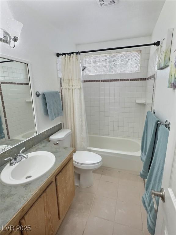 3585 Winner Dr, Las Vegas, NV 89120 - bathroom with shower / tub combo, vanity, and tile patterned flooring