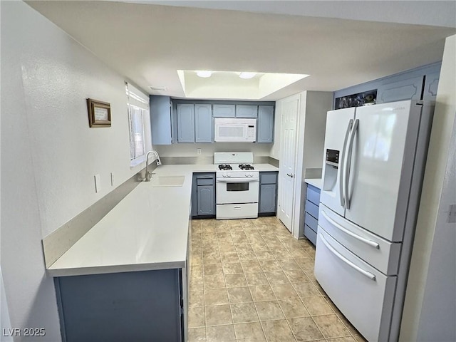 3585 Winner Dr, Las Vegas, NV 89120 - kitchen with white appliances, light countertops, gray cabinets, and a tray ceiling