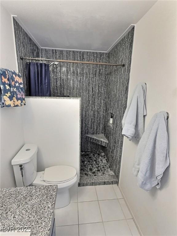 3585 Winner Dr, Las Vegas, NV 89120 - full bath with tiled shower, tile patterned flooring, and vanity