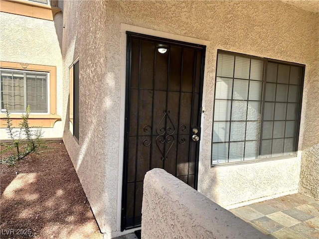 1409 Santa Margarita St Unit B, Las Vegas, NV 89146 - view of exterior entry with stucco siding