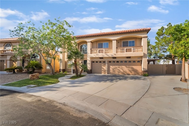 1403 Graystone Canyon Ave, Las Vegas, NV 89183 - mediterranean / spanish-style home featuring stucco siding, driveway, a tile roof, a garage, and a balcony