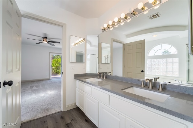 1403 Graystone Canyon Ave, Las Vegas, NV 89183 - bathroom featuring plenty of natural light, double vanity, ceiling fan, and wood finished floors