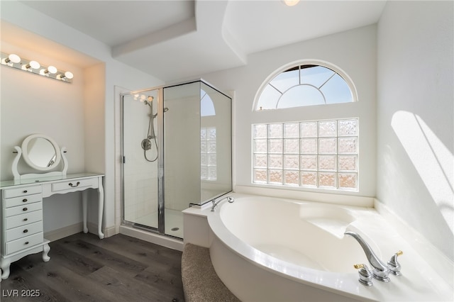 1403 Graystone Canyon Ave, Las Vegas, NV 89183 - full bath with plenty of natural light, a garden tub, wood finished floors, and a shower stall