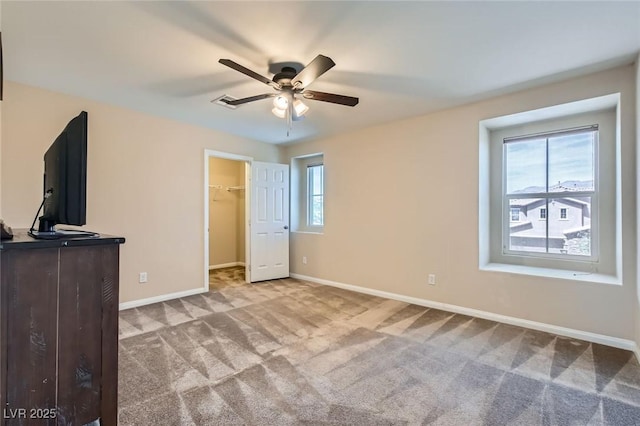 3605 Sapphire Sea Ct, North Las Vegas, NV 89031 - unfurnished bedroom featuring carpet, a spacious closet, and ceiling fan