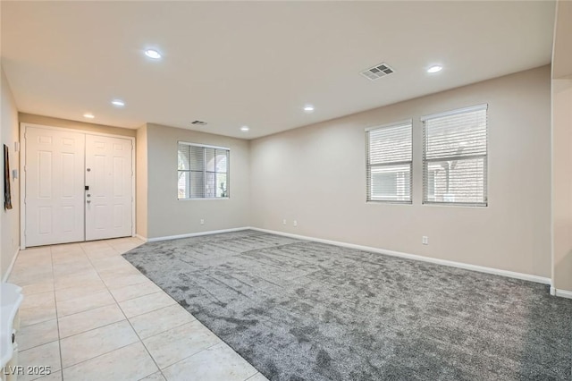 3605 Sapphire Sea Ct, North Las Vegas, NV 89031 - foyer entrance with light colored carpet, light tile patterned floors, and recessed lighting