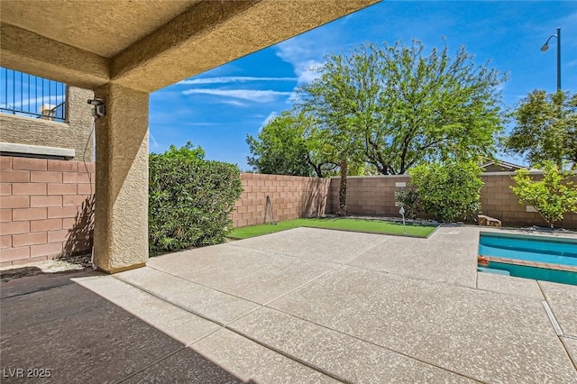3605 Sapphire Sea Ct, North Las Vegas, NV 89031 - fenced backyard with a patio
