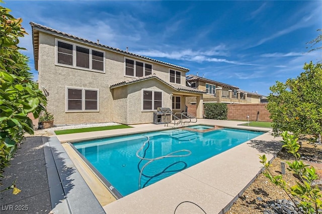3605 Sapphire Sea Ct, North Las Vegas, NV 89031 - view of swimming pool featuring a fenced backyard, a patio, a grill, and a pool with connected hot tub