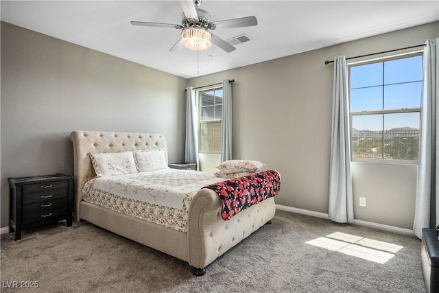 2577 Tolmezzo St, Henderson, NV 89044 - carpeted bedroom with multiple windows and a ceiling fan