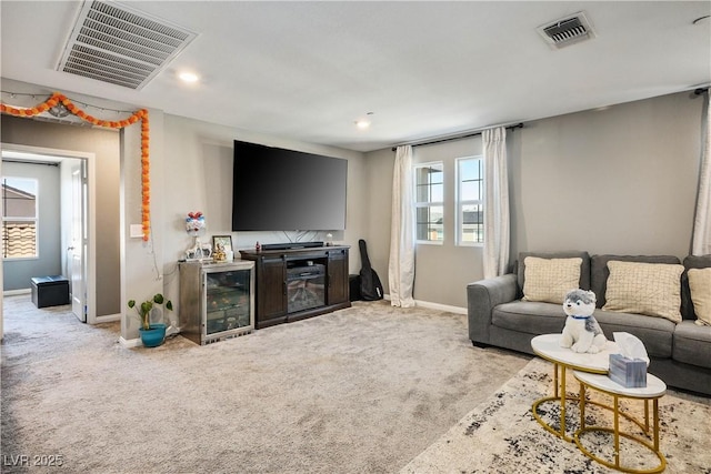 2577 Tolmezzo St, Henderson, NV 89044 - living area with carpet flooring and beverage cooler