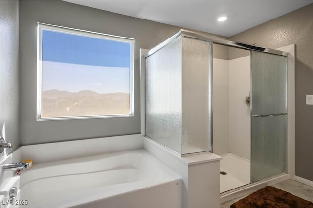 2577 Tolmezzo St, Henderson, NV 89044 - bathroom featuring a garden tub and a shower stall