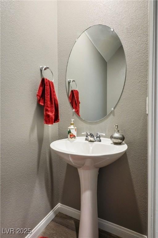 2577 Tolmezzo St, Henderson, NV 89044 - bathroom featuring baseboards and wood finished floors