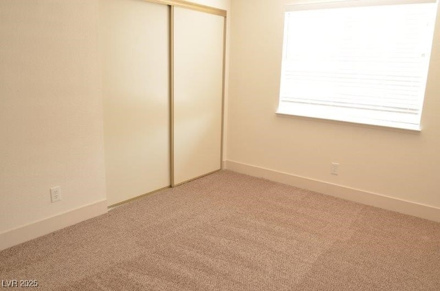 7253 Alsop Ct, Las Vegas, NV 89156 - unfurnished bedroom with light carpet and a closet