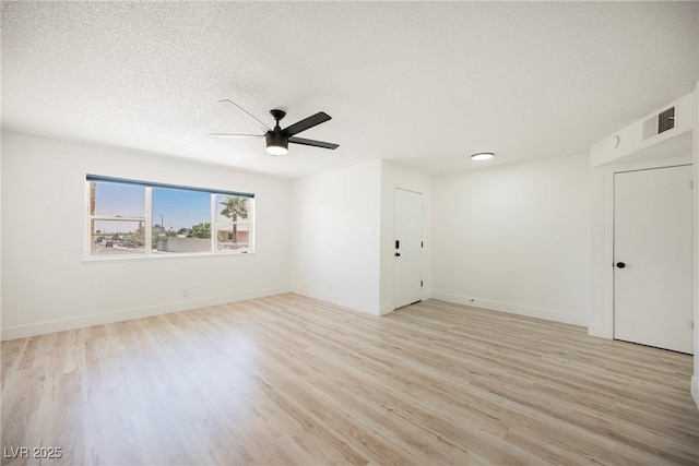 716 Vincent Way, Las Vegas, NV 89145 - empty room with a ceiling fan, light wood-style floors, and a textured ceiling