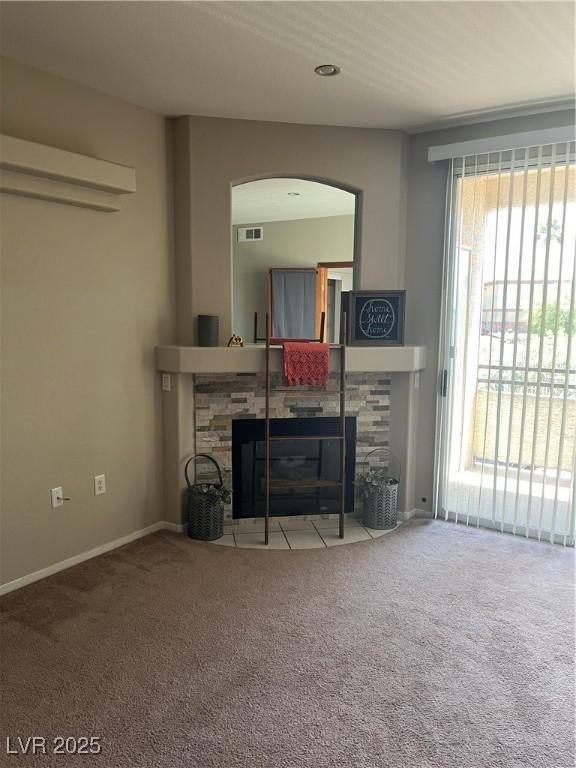 1830 N Buffalo Dr Unit 2021, Las Vegas, NV 89128 - living area with a fireplace, carpet flooring, and arched walkways