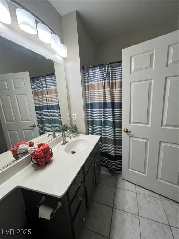 1830 N Buffalo Dr Unit 2021, Las Vegas, NV 89128 - full bathroom with vanity, tile patterned flooring, and curtained shower