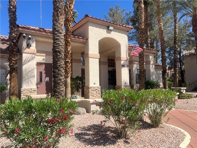 1830 N Buffalo Dr Unit 2021, Las Vegas, NV 89128 - mediterranean / spanish-style house with a tile roof, stucco siding, and stone siding