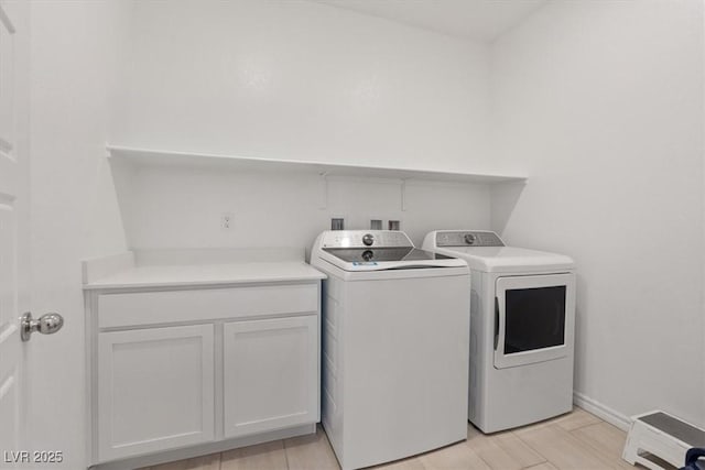 9221 Alden Pointe Ct, Las Vegas, NV 89143 - laundry area featuring washer and clothes dryer and cabinet space