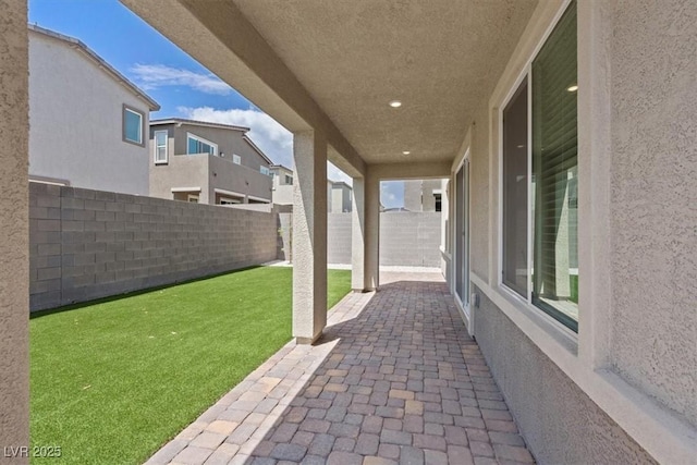 9221 Alden Pointe Ct, Las Vegas, NV 89143 - fenced backyard with a patio area