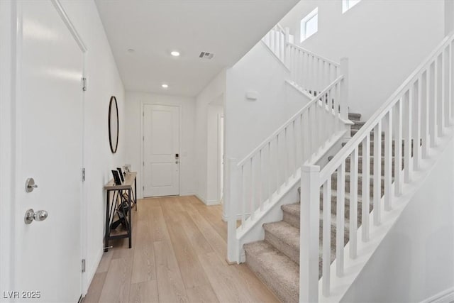 9221 Alden Pointe Ct, Las Vegas, NV 89143 - foyer entrance featuring light wood-style floors, stairs, and recessed lighting