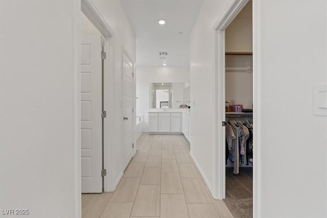 9221 Alden Pointe Ct, Las Vegas, NV 89143 - hallway with light tile patterned flooring and recessed lighting