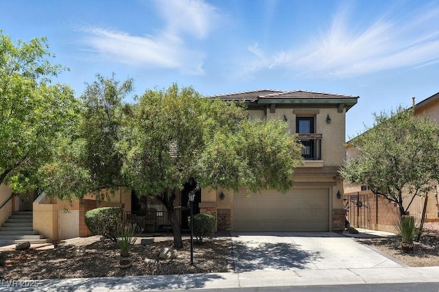 9105 Picket Fence Ave, Las Vegas, NV 89143 - view of front facade featuring driveway, an attached garage, stucco siding, stone siding, and stairs