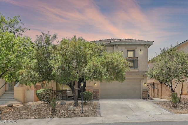 9105 Picket Fence Ave, Las Vegas, NV 89143 - view of front of house with concrete driveway, an attached garage, stucco siding, and stone siding