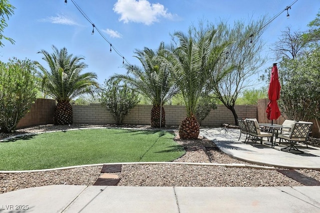 9105 Picket Fence Ave, Las Vegas, NV 89143 - fenced backyard featuring a patio area