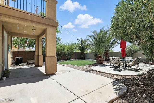 9105 Picket Fence Ave, Las Vegas, NV 89143 - fenced backyard with a patio area