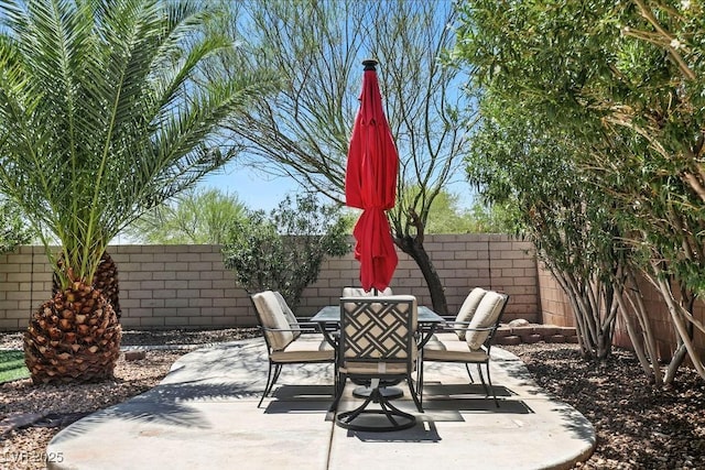 9105 Picket Fence Ave, Las Vegas, NV 89143 - fenced backyard featuring outdoor dining space and a patio