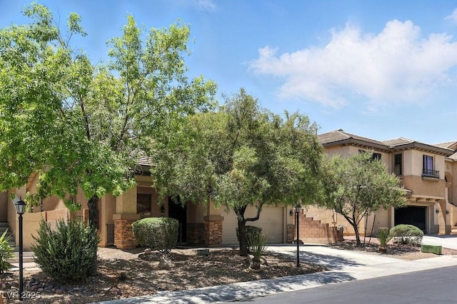 9105 Picket Fence Ave, Las Vegas, NV 89143 - view of front of property with concrete driveway and stucco siding