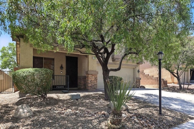 9105 Picket Fence Ave, Las Vegas, NV 89143 - view of front of property with stucco siding, driveway, and stone siding