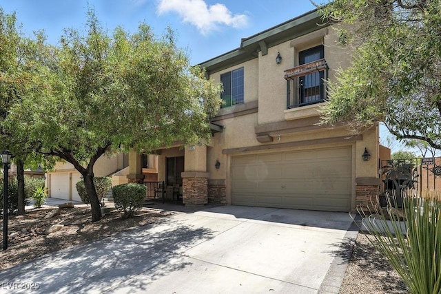 9105 Picket Fence Ave, Las Vegas, NV 89143 - mediterranean / spanish-style house with stone siding, driveway, an attached garage, and stucco siding
